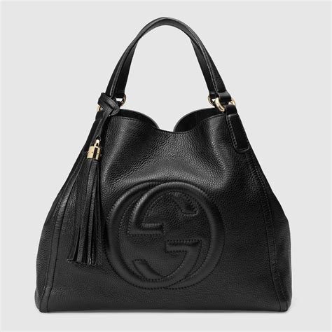 black gucci handbag with white|Gucci adjustable shoulder handbags.